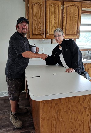 Eric Miller with home buyer